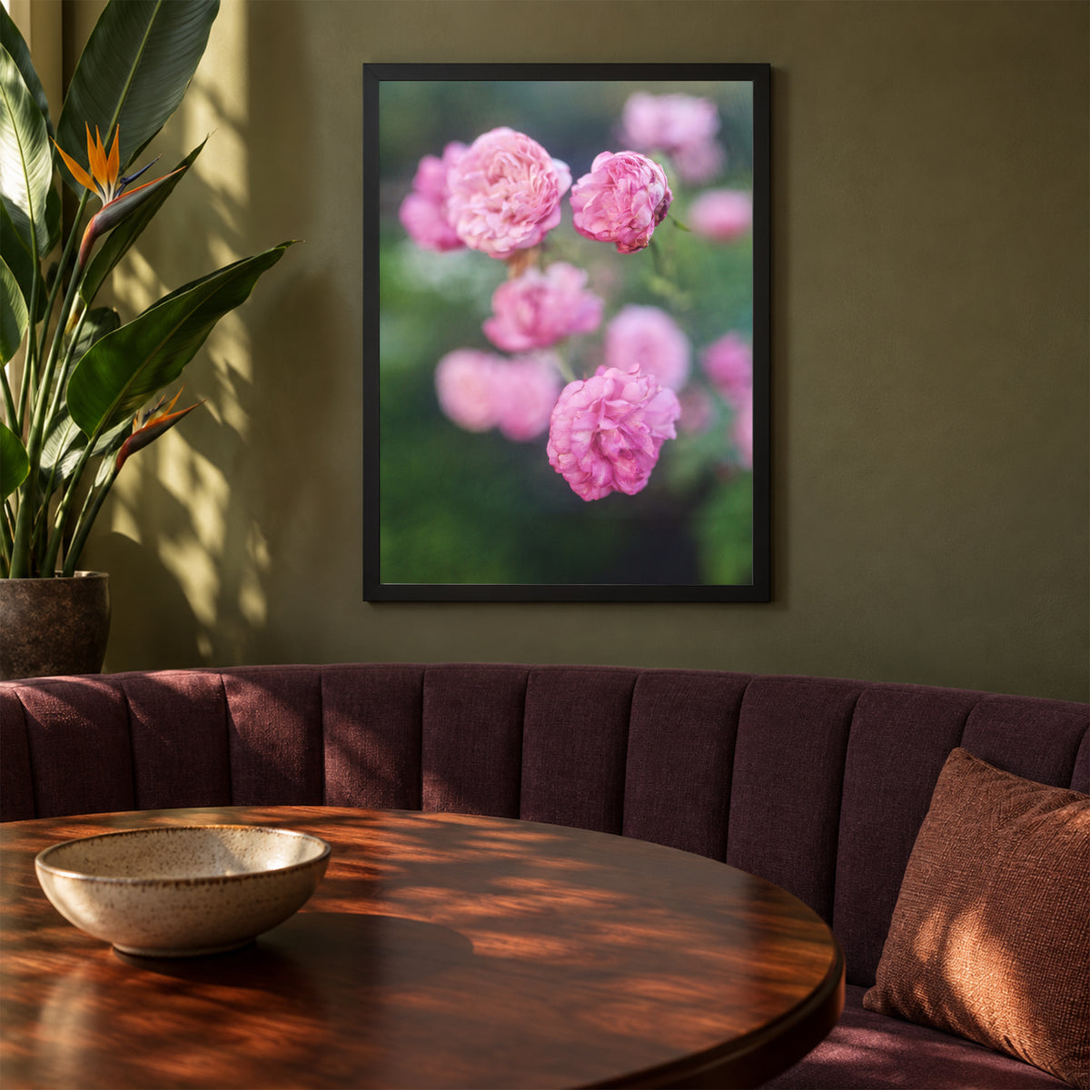 Caldwell Pink II, 18×24 inch print shown in a styled room mockup. Cluster of soft pink roses floating against a blurred green garden. Frame shown for styling; print sold unframed.