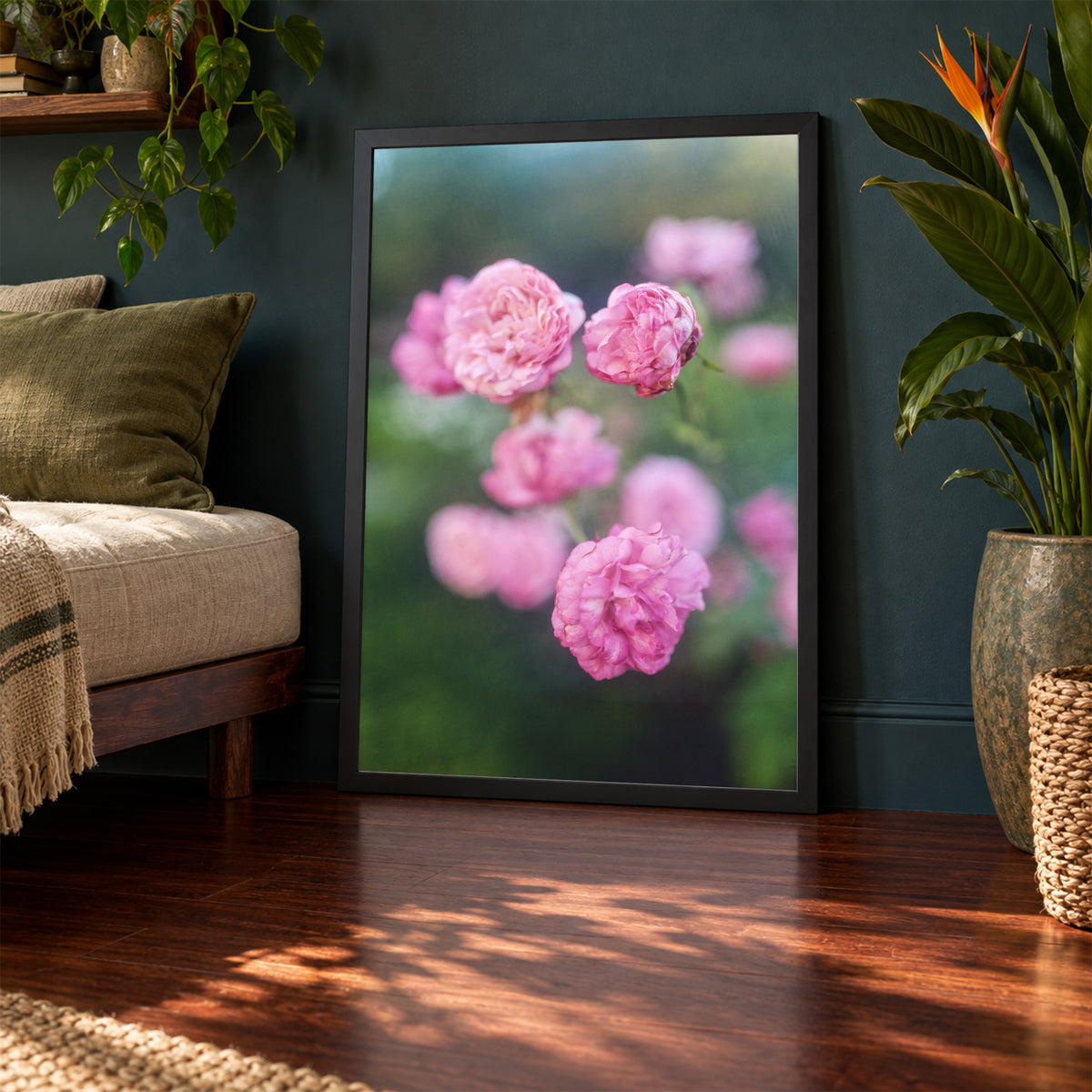 Caldwell Pink II, 24×36 inch print shown in a styled room mockup. Cluster of soft pink roses floating against a blurred green garden. Frame shown for styling; print sold unframed.