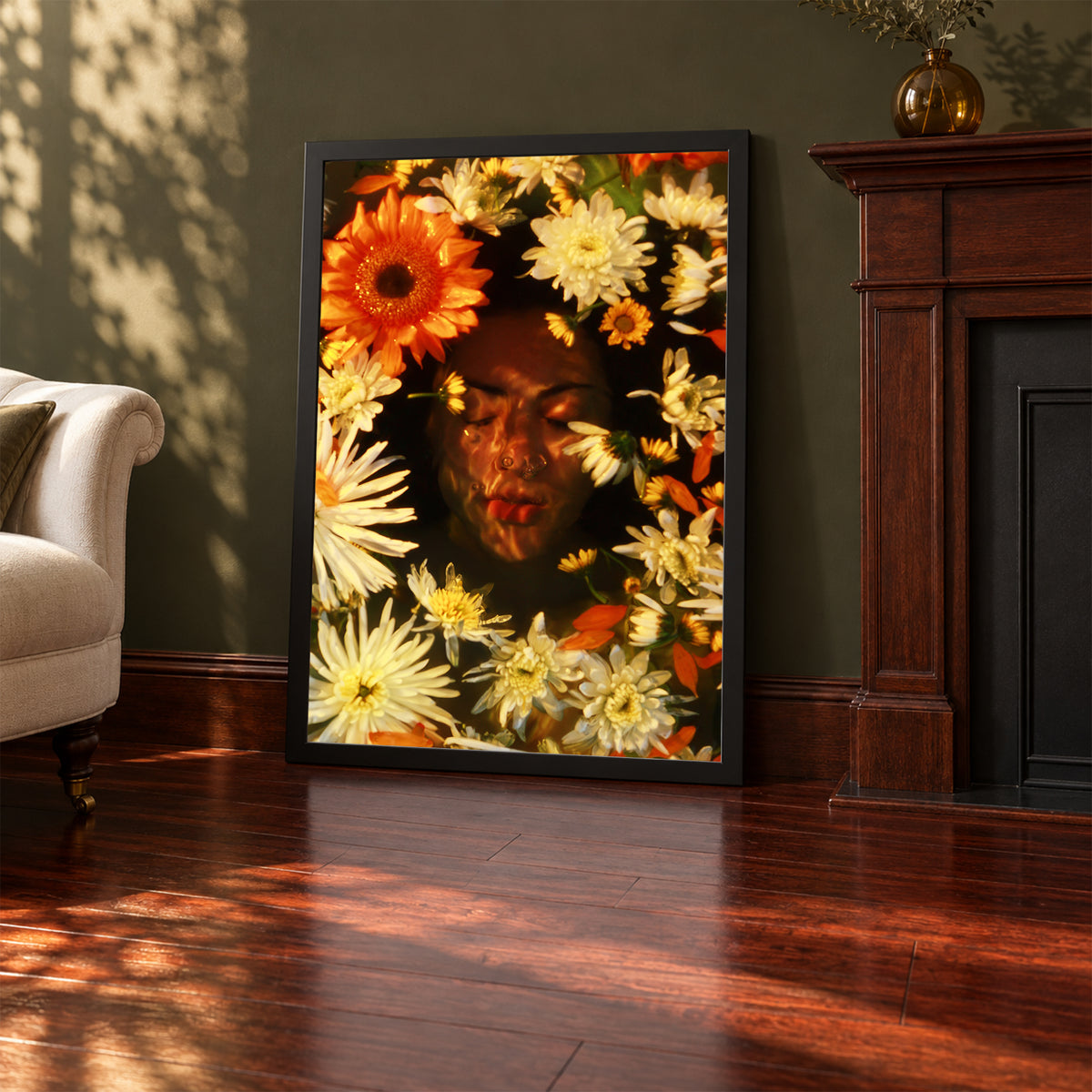 Ophelia's Dream, 24×36 inch print shown in a styled room mockup. Face framed by orange, cream, and yellow flowers in a warm-toned portrait. Frame shown for styling; print sold unframed.